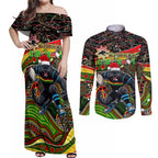 Merry Christmas Penrith Panthers Couples Matching Off Shoulder Maxi Dress and Long Sleeve Button Shirt Aboriginal Santa Rugby Mascot - The Riff