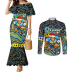 Merry Christmas Gold Coast Titans Couples Matching Mermaid Dress and Long Sleeve Button Shirt Aboriginal Santa Rugby Mascot - Light Blue