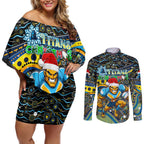 Merry Christmas Gold Coast Titans Couples Matching Off Shoulder Short Dress and Long Sleeve Button Shirt Aboriginal Santa Rugby Mascot - Light Blue