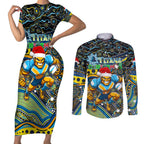 Merry Christmas Gold Coast Titans Couples Matching Short Sleeve Bodycon Dress and Long Sleeve Button Shirt Aboriginal Santa Rugby Mascot - Light Blue
