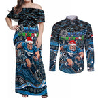 Merry Christmas AFL Carlton Blues Couples Matching Off Shoulder Maxi Dress and Long Sleeve Button Shirt Aboriginal Santa Football Mascot