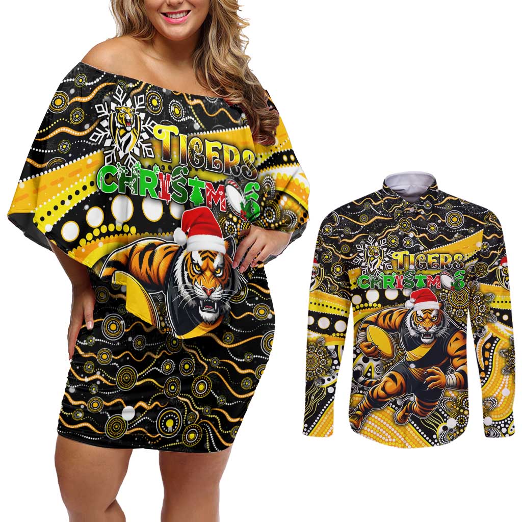 Merry Christmas AFL Richmond Tigers Couples Matching Off Shoulder Short Dress and Long Sleeve Button Shirt Aboriginal Santa Football Mascot