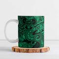Aotearoa Maori Hei Tiki Ceramic Mug Kakariki Kowhaiwhai Puhoro Motif