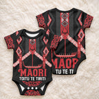 Toitu Te Tiriti Waitangi Baby Onesie Black Wharenui House