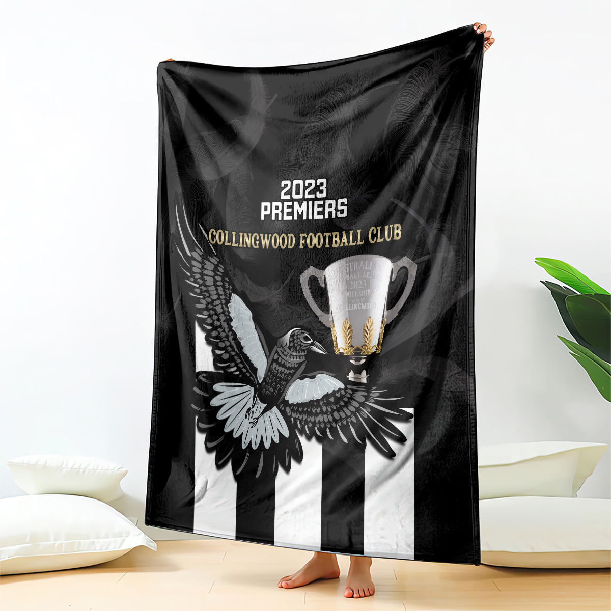 afl-collingwood-blanket-magpies-premiers-2023-with-trophy-proud