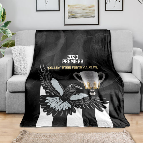 afl-collingwood-blanket-magpies-premiers-2023-with-trophy-proud