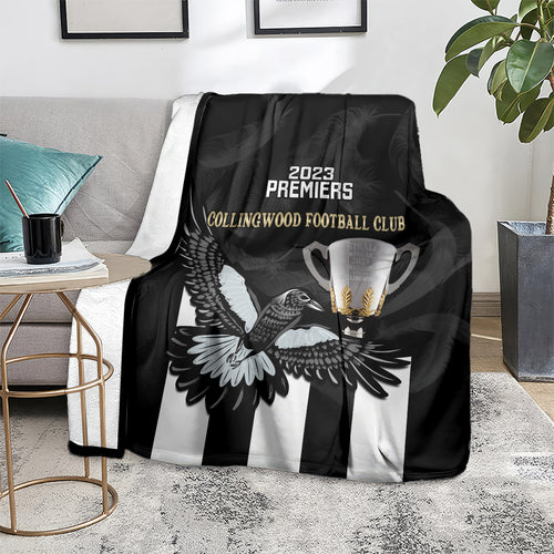 afl-collingwood-blanket-magpies-premiers-2023-with-trophy-proud