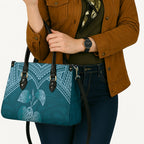 Cyan New Zealand Kawakawa Maori Ngaru Leather Bag