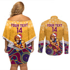 custom-brisbane-lions-football-christmas-couples-matching-off-shoulder-short-dress-and-long-sleeve-button-shirt-merry-xmas-2023-mix-aboriginal-art