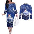 custom-north-melbourne-football-christmas-couples-matching-off-the-shoulder-long-sleeve-dress-and-long-sleeve-button-shirt-merry-xmas-2023-mix-aboriginal-art