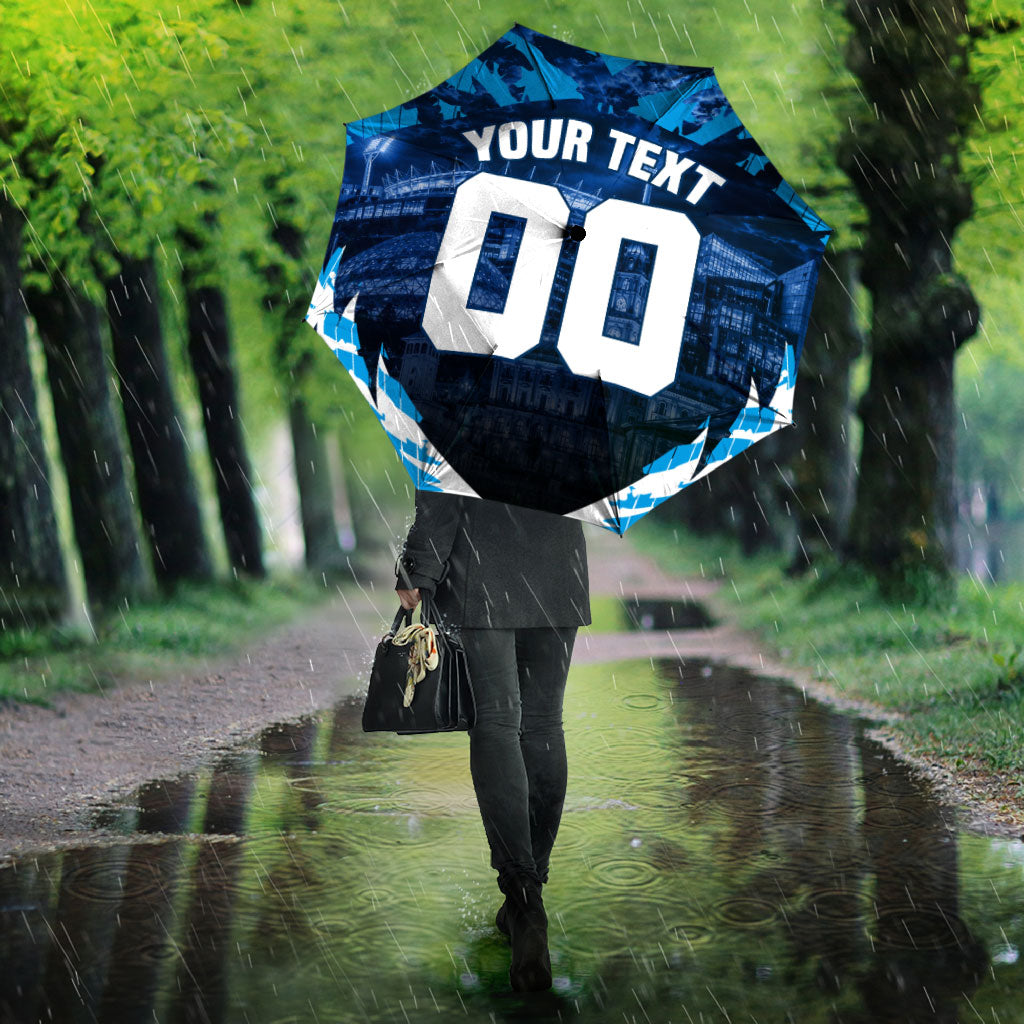 Personalised Geelong Cat Football Umbrella Electric Blue Mascot Charging Cityscape