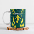 Australian Opals Basketball Ceramic Mug Iconic Green And Gold Silhouette With Sharp Abstract Graphics