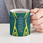 Australian Opals Basketball Ceramic Mug Iconic Green And Gold Silhouette With Sharp Abstract Graphics