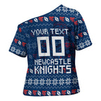Personalized Newcastle Knights Christmas Cross Shoulder Shirt Australian Rugby Fans - Pixelated Ugly Xmas Pattern Mascot Santa
