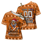 Personalized Wests Tigers Christmas Cross Shoulder Shirt Australian Rugby Fans - Pixelated Ugly Xmas Pattern Mascot Santa