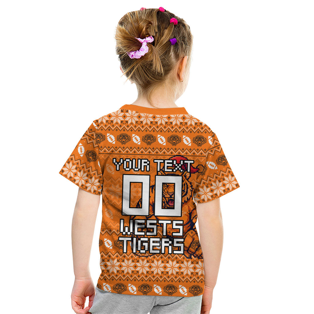 Personalized Wests Tigers Christmas Kid T Shirt Australian Rugby Fans - Pixelated Ugly Xmas Pattern Mascot Santa