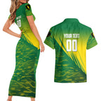 Personalized Socceroos Sport Couples Matching Short Sleeve Bodycon Dress and Hawaiian Shirt Green Gold Dynamic Wave Pattern