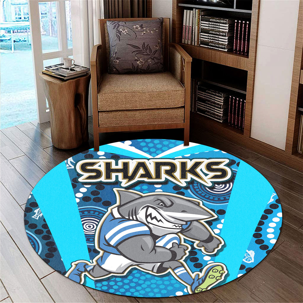 sharks-rugby-round-rug-sharks-with-rugby-ball-and-aboriginal-dot-design-blue-background-round-rug