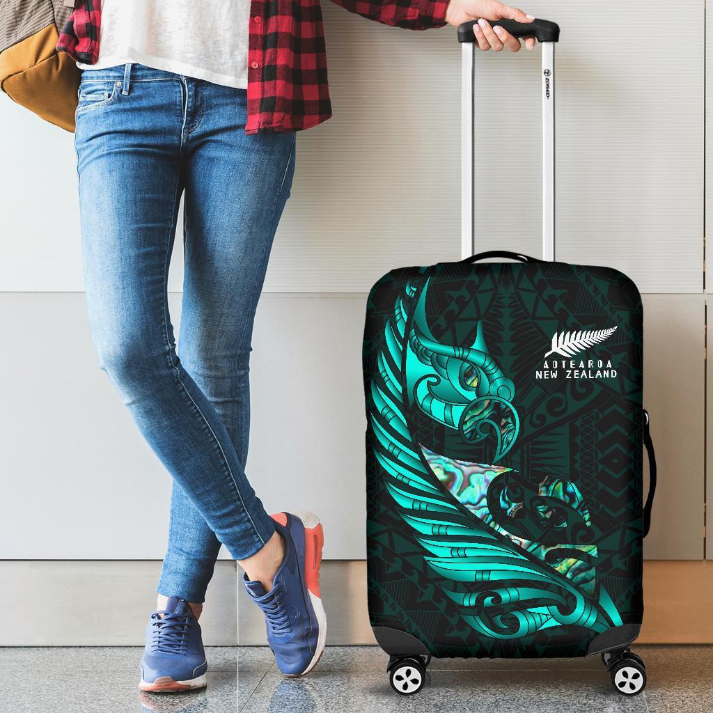 new-zealand-luggage-cover-manaia-paua-fern-wing-turquoise