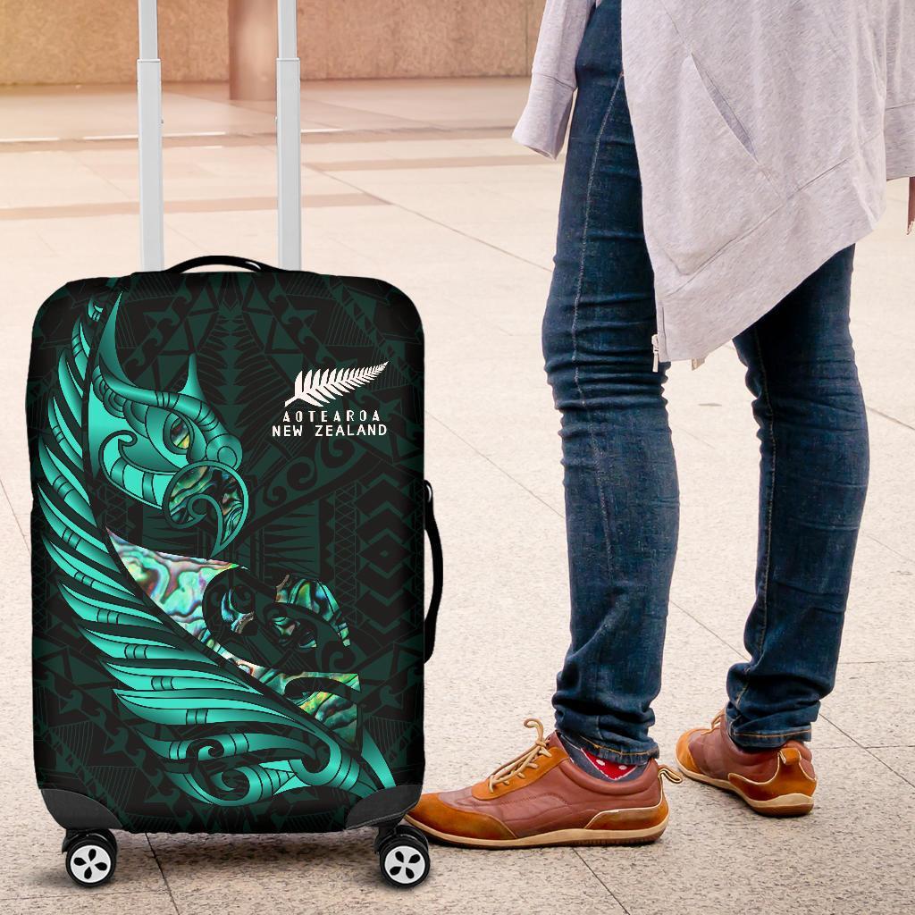 new-zealand-luggage-cover-manaia-paua-fern-wing-turquoise