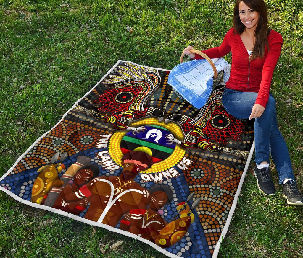 the-land-owns-us-premium-quilt